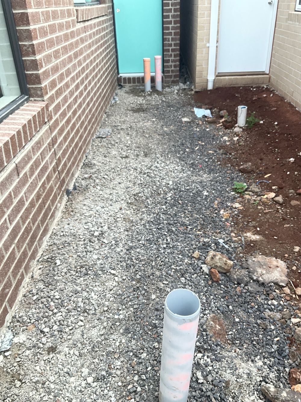Stormwater pipe left uncapped during fit off, open to rubble, Aintree, Deanside