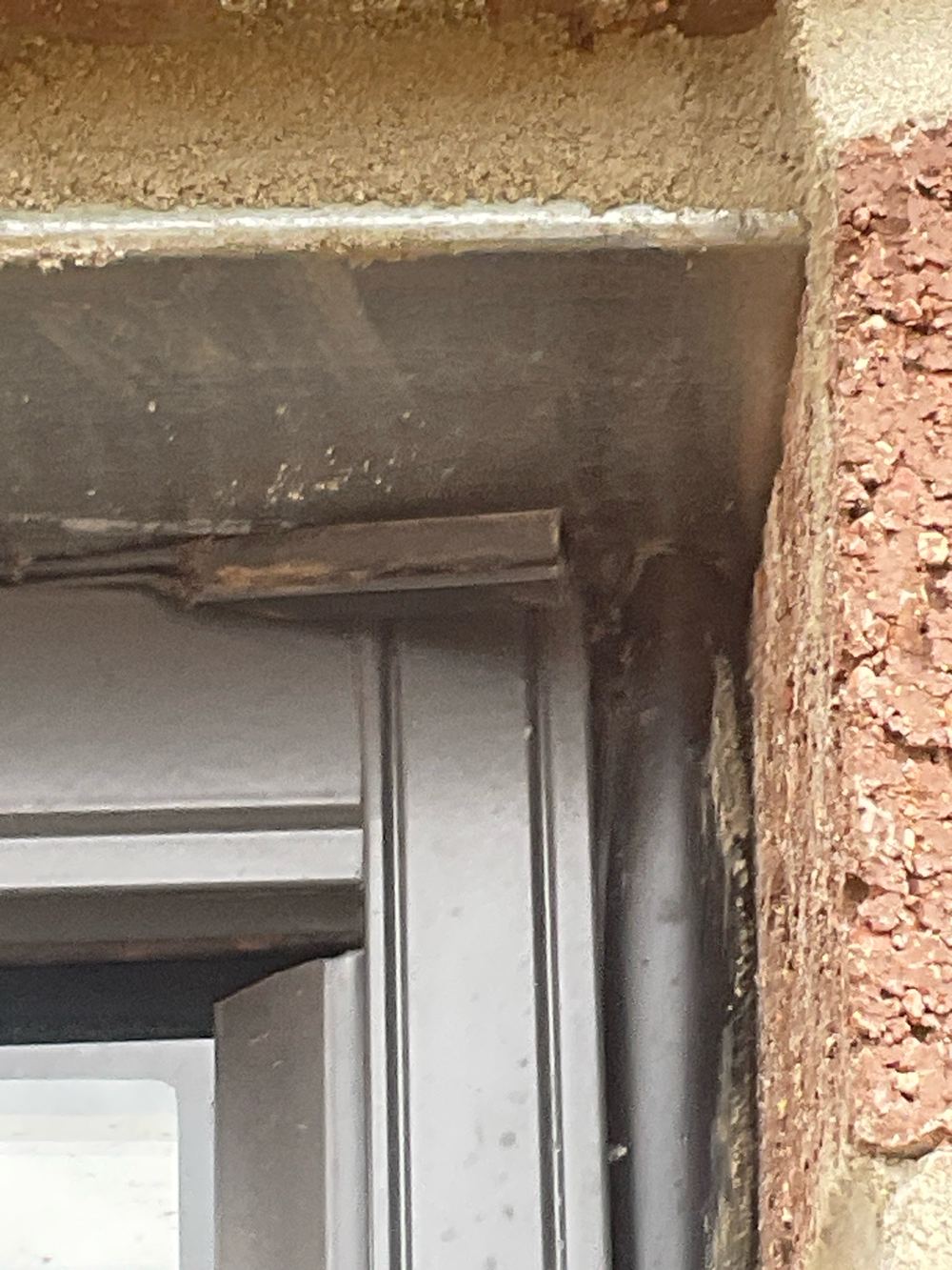 Window rubber flashing not sitting properly between the frame and the cladding, found during a fixing inspection in Aintree