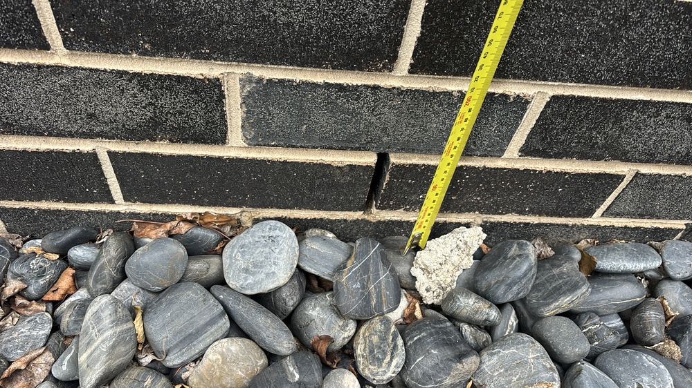 Garden soil built up against the cladding, below the 150mm clearance required, found during a pre-purchase inspection in Braybrook