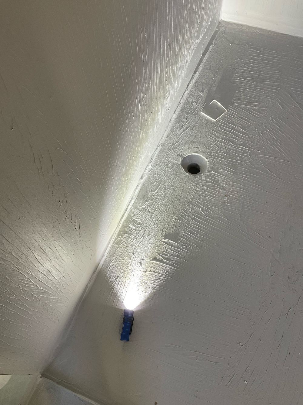 Slab standing too high in the shower floor, leaving no room for the tile bed, found during a waterproofing inspection in Sunshine West